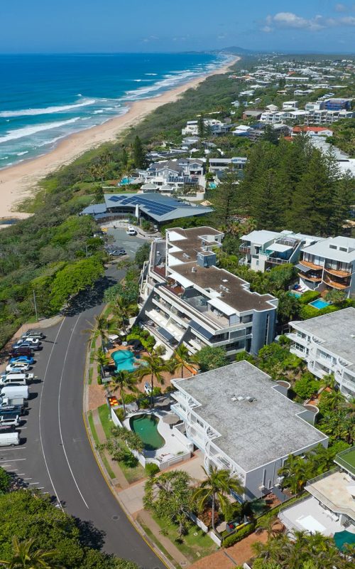 Bird's eye view of La Mer Beachfront Apartments and Sunshine Beach coastline